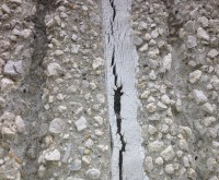 Sealant Failure - raked aggregate wall, split sealant, failed, worn out, cracked