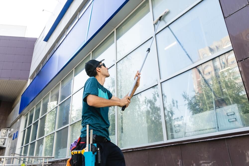 Male,Professional,Cleaning,Service,Worker,In,Overalls,Cleans,The,Windows