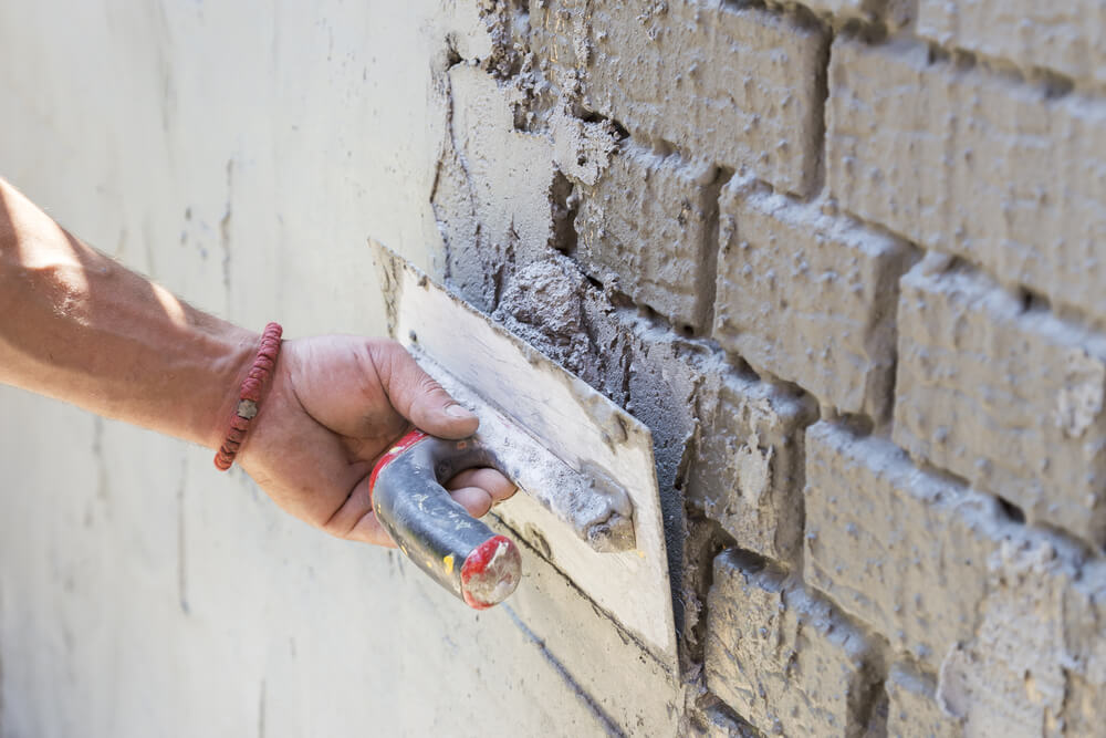 Man,Plastering,A,Brick,Wall,,Restoration.