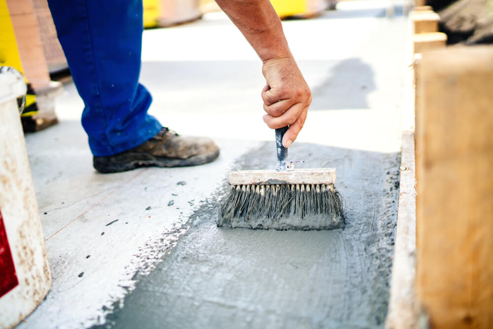 Construction,Worker,Using,Brush,And,Primer,For,Hydroisolating,And,Waterproofing